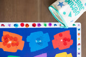 Color placemat, Colors placemat, Colorful placemat, Colorful placemats, Child pointing at color illustrations on placemat, Placemat with Butterflies and racecars, Placemat for kindergartners, preschoolers play with placemats, 2-year-old plays with placemat, Keeping a 19-month-old entertained at home with placemat activities