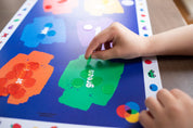Color placemat, Colors placemat, Colorful placemat, Colorful placemats, Child pointing at color illustrations on placemat, Placemat with Butterflies and racecars, Placemat for kindergartners, preschoolers play with placemats, 2-year-old plays with placemat, Keeping a 19-month-old entertained at home with placemat activities