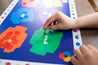 Color placemat, Colors placemat, Colorful placemat, Colorful placemats, Child pointing at color illustrations on placemat, Placemat with Butterflies and racecars, Placemat for kindergartners, preschoolers play with placemats, 2-year-old plays with placemat, Keeping a 19-month-old entertained at home with placemat activities